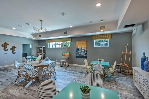 Bright common area with tables and chairs