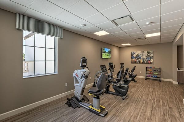 Well-equipped fitness room with exercise machines