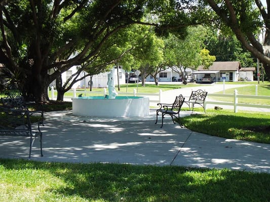 Outdoor area with a fountain and benches