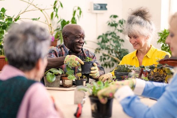 Residents engaged in a gardening activity indoors
