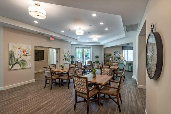 Bright interior common area with tables and chairs