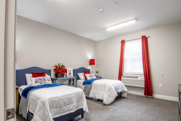 A cozy shared resident room with two beds