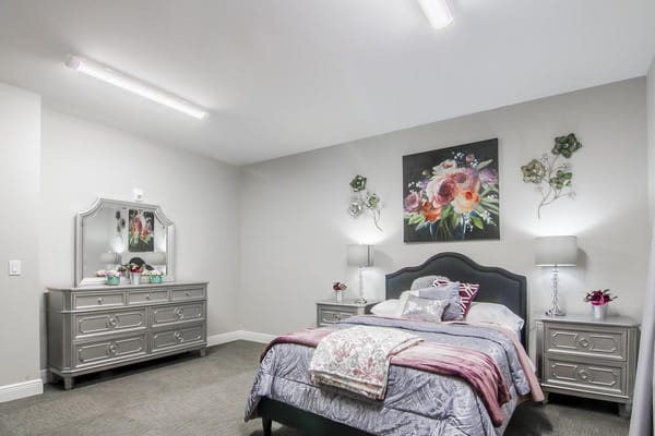 A well-decorated private resident room with floral decor