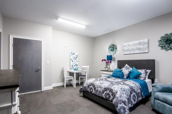 Well-furnished private resident room with decor.