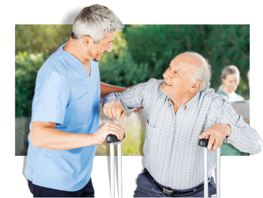 Caregiver assisting a senior man outdoors