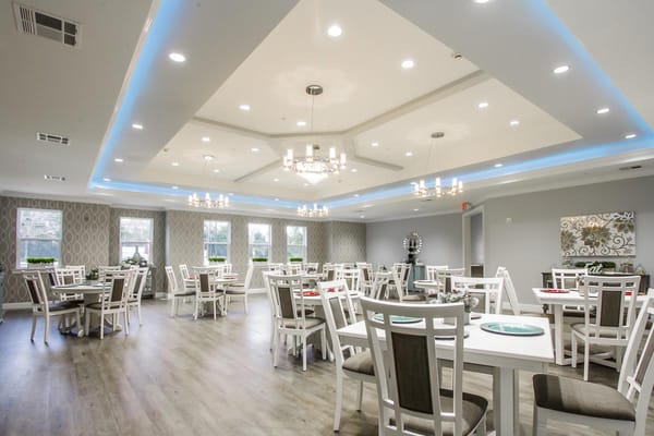 Bright dining area with modern decor and seating