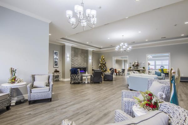 Bright common area with holiday decorations and comfortable seating