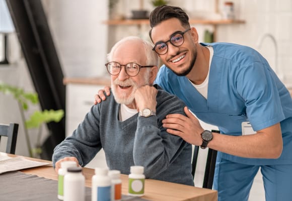 A caregiver with a resident in a bright interior setting