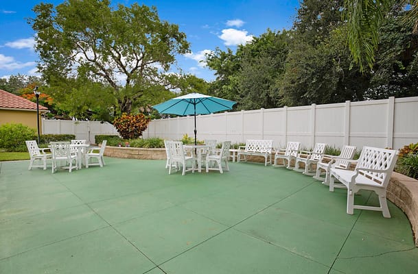 Outdoor patio area with seating and an umbrella