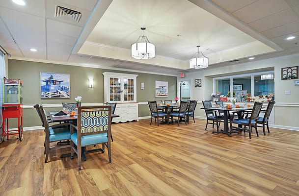 Bright dining room setup with tables and chairs