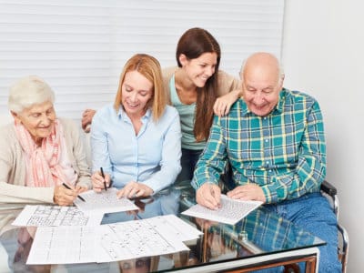 Residents and staff engaged in an activity together