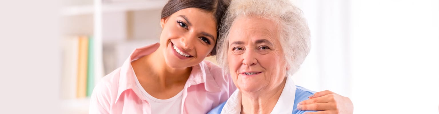 Staff member and resident posing together