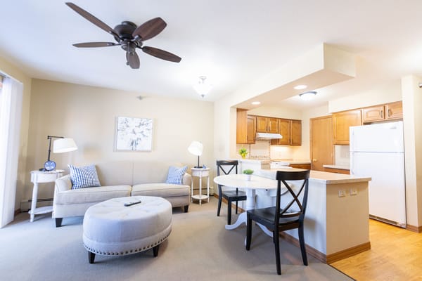 Bright and cozy living area in a senior living apartment