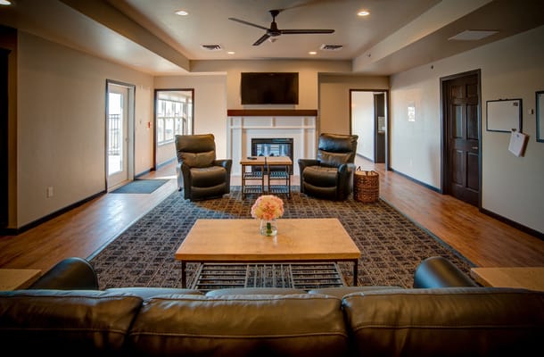 Interior common area with seating and a fireplace