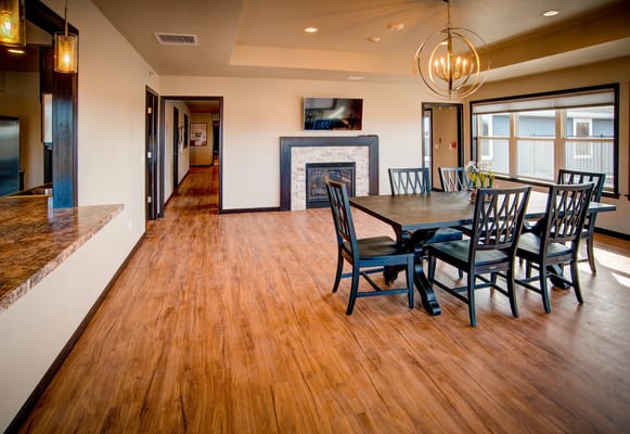 Dining area with a large table and fireplace