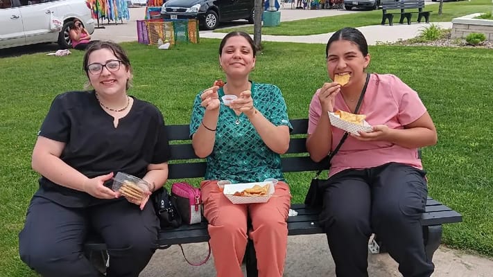 Staff members enjoying snacks in an outdoor space