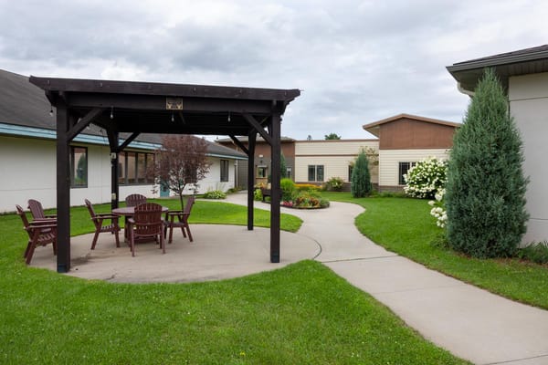 Outdoor patio area with seating and landscaped garden