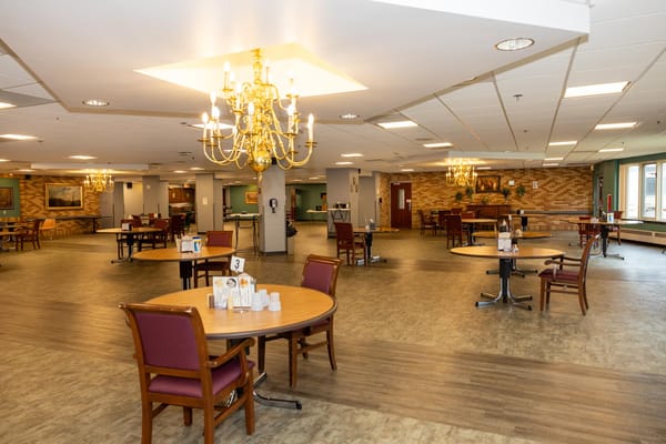 Spacious dining room with tables and seating