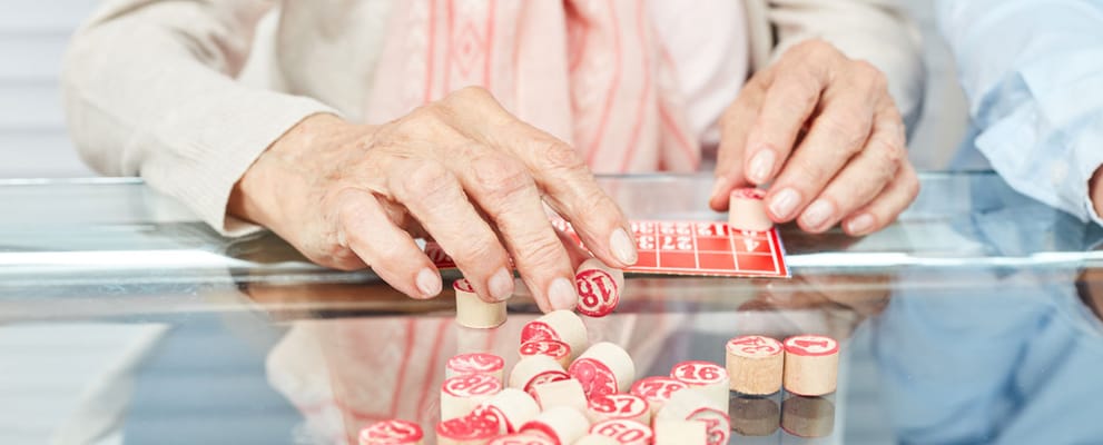 Residents playing bingo at a table