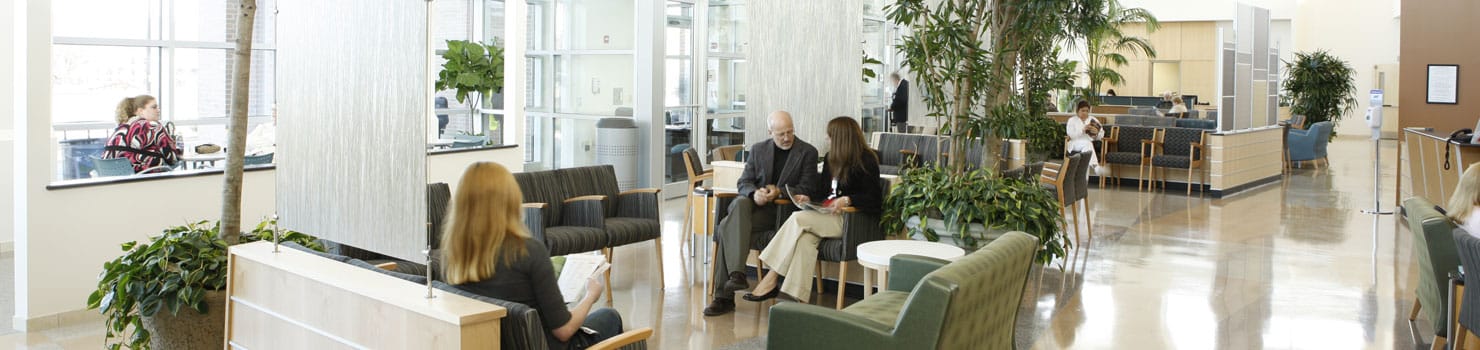 Bright interior common area with residents and staff