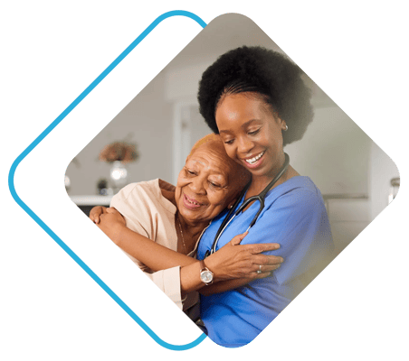 Caregiver embracing a senior resident