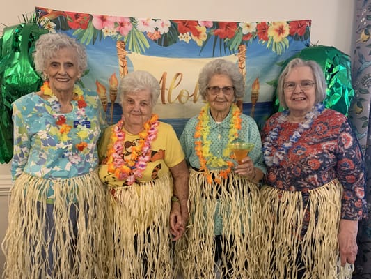 Residents participating in a festive luau activity