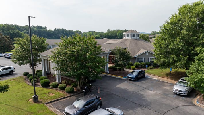 Aerial view of the facility entrance and parking area