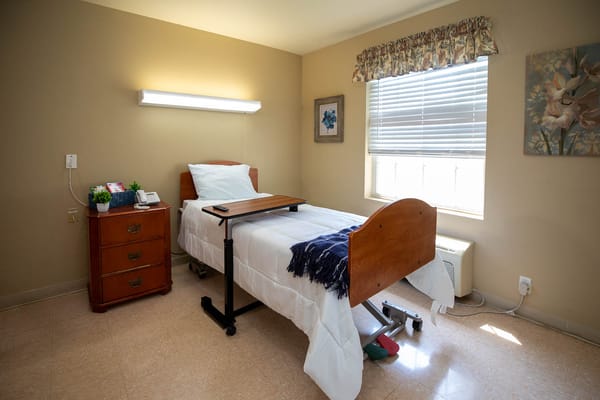 Cozy resident room with a bed and window