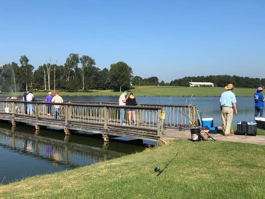 Residents enjoying fishing on a dock by the water