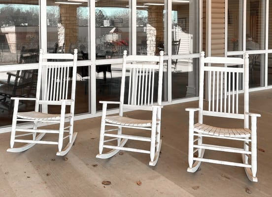 Rocking chairs on a porch in an outdoor space