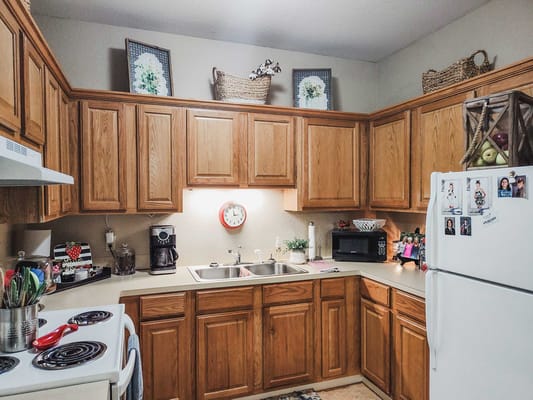 Interior view of a kitchen with wooden cabinets