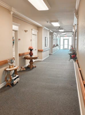 Interior hallway with floral decorations and seating