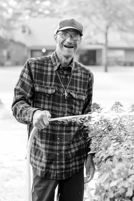 Resident gardening outside the facility