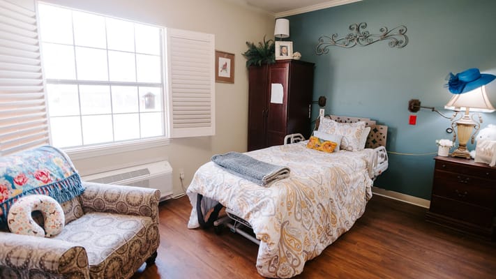 Cozy private resident room with bed and chair