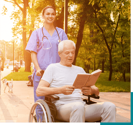 Healthcare worker assisting a resident outdoors