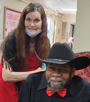 Staff member assisting a resident in a common area