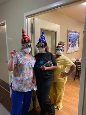 Staff celebrating New Year's Eve in a common area