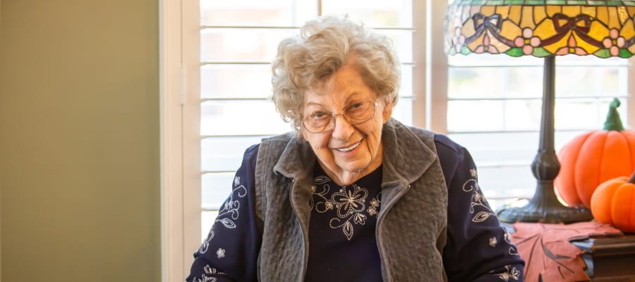 Smiling resident in an inviting common area