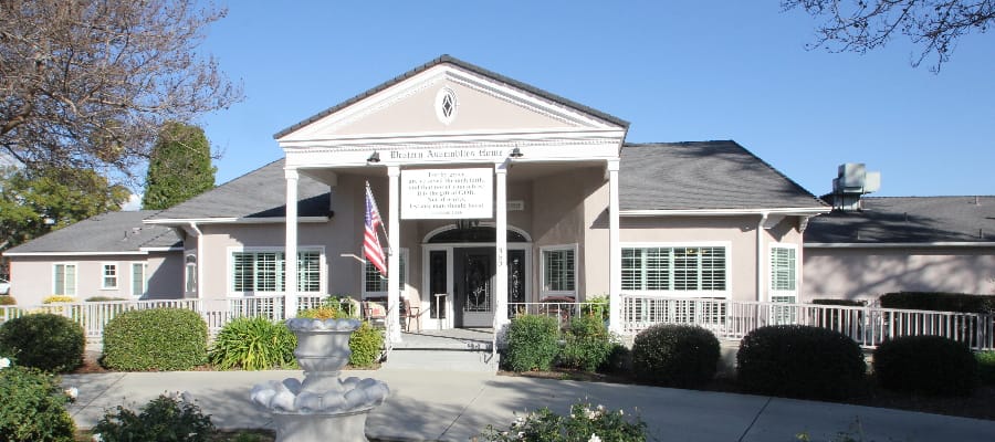 Front exterior of Western Assemblies Home with garden
