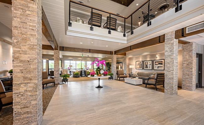 Spacious lobby area with comfortable seating and decor