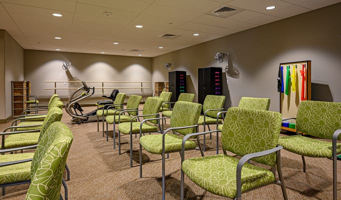 Interior view of a multi-use activity space with chairs and equipment