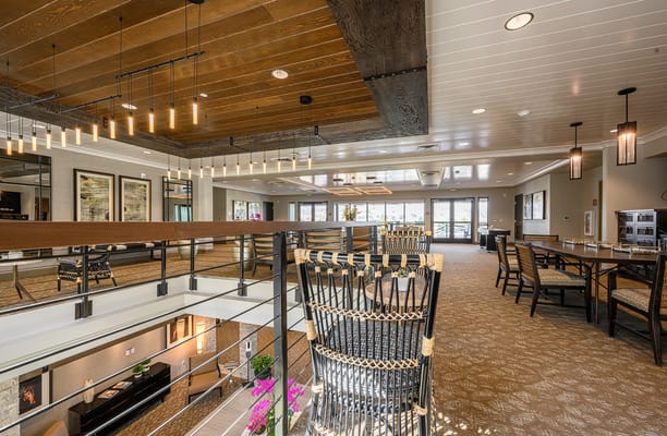 Bright and spacious common area with seating and artwork