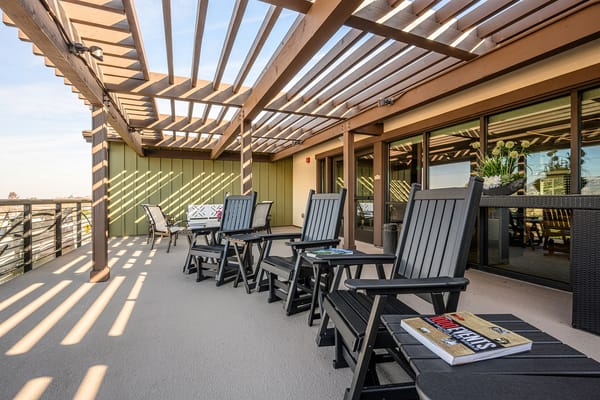 Outdoor seating area with shaded loungers