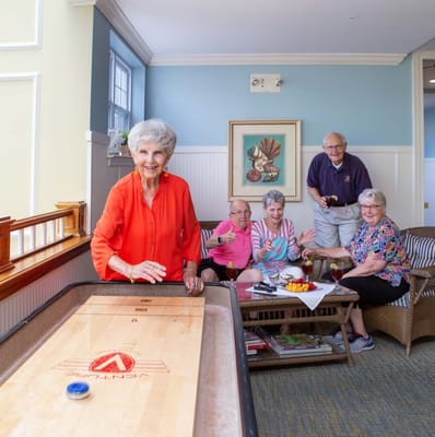 Residents enjoying a game in a common area