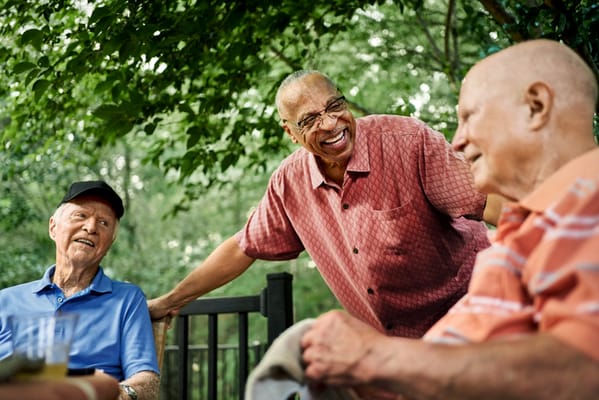 Residents enjoying conversation in a garden