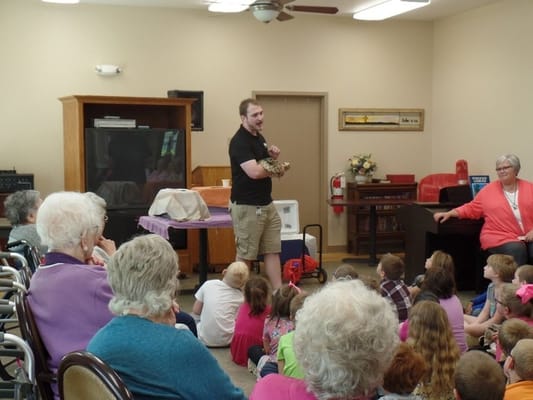 Residents engaging in an educational activity with a presenter