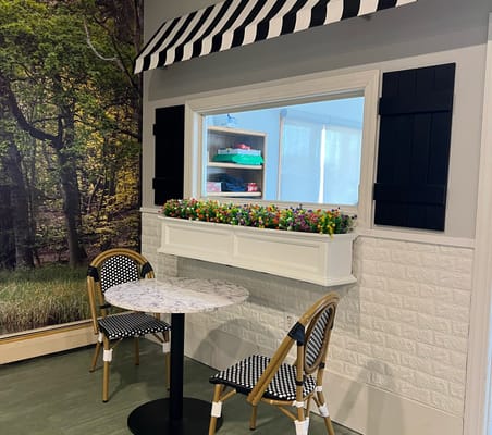 Interior space with a small table and decorative window