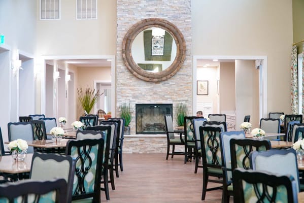 Dining area with tables and a decorative fireplace