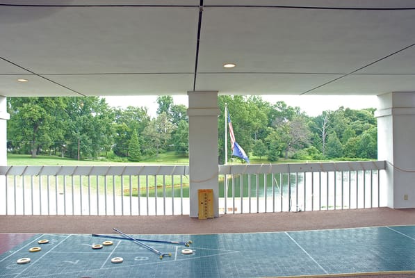 View of outdoor space with greenery and lake