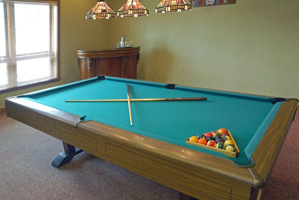 Interior view of a billiard table in a recreational room